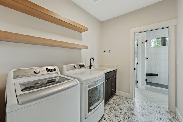 5206 S Willamette St, Spokane, WA 99223 - laundry room featuring cabinet space, washing machine and dryer, and light tile patterned floors