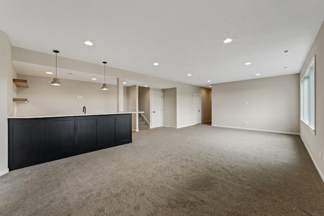 5206 S Willamette St, Spokane, WA 99223 - unfurnished living room with carpet, recessed lighting, stairs, and wet bar