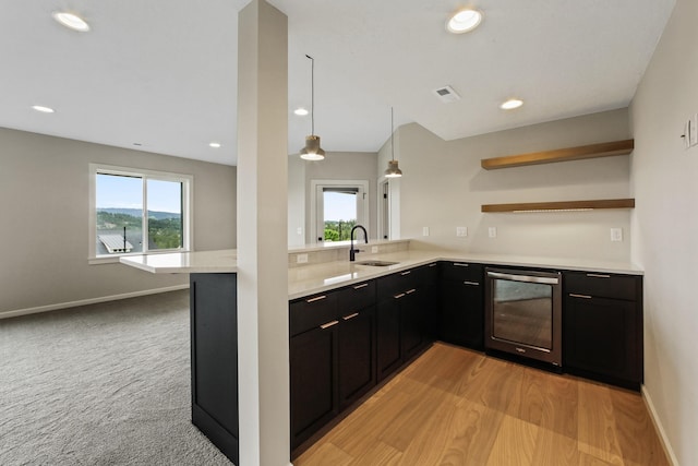 5206 S Willamette St, Spokane, WA 99223 - kitchen featuring beverage cooler, dark cabinetry, light countertops, recessed lighting, and a peninsula