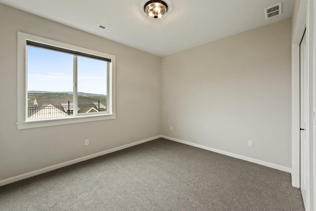 5206 S Willamette St, Spokane, WA 99223 - spare room with dark colored carpet and baseboards