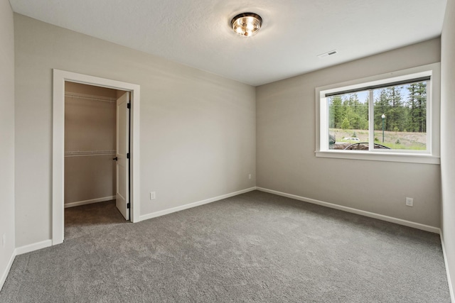 5206 S Willamette St, Spokane, WA 99223 - unfurnished bedroom featuring carpet flooring, a spacious closet, and a closet