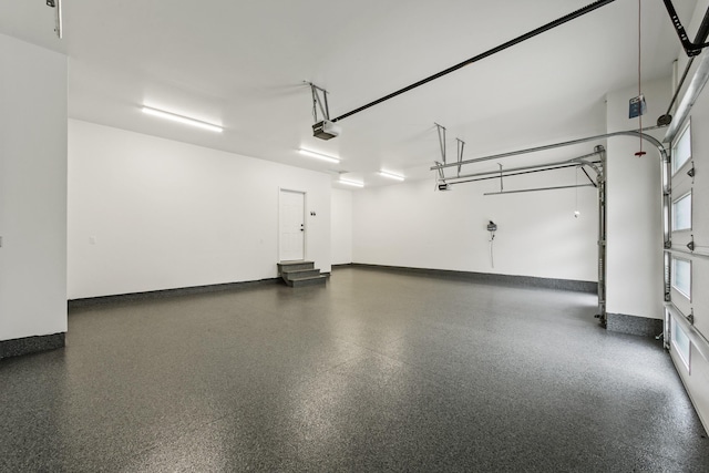 5206 S Willamette St, Spokane, WA 99223 - garage with a garage door opener and baseboards