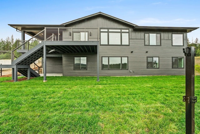5206 S Willamette St, Spokane, WA 99223 - rear view of property with a lawn, a deck, stairway, and board and batten siding
