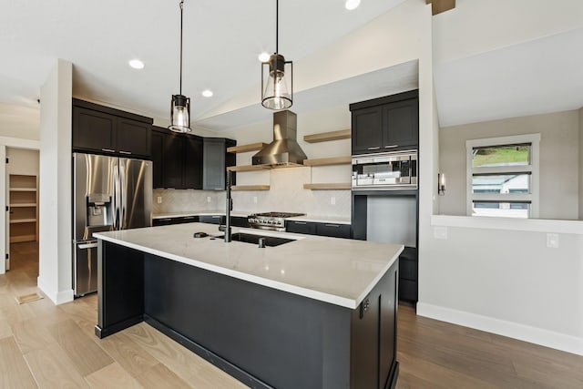5206 S Willamette St, Spokane, WA 99223 - kitchen with appliances with stainless steel finishes, wall chimney range hood, open shelves, backsplash, and light wood-style floors