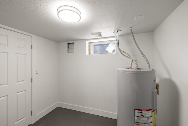 505 S University Rd, Spokane Valley, WA 99206 - below grade area featuring electric water heater and a textured ceiling