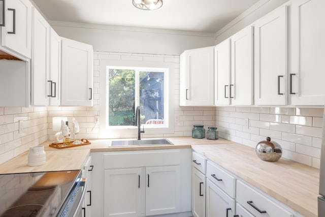 505 S University Rd, Spokane Valley, WA 99206 - kitchen with backsplash, white cabinets, and light countertops