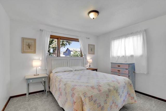 1310 N Woodruff Rd, Spokane Valley, WA 99206 - bedroom featuring multiple windows and carpet