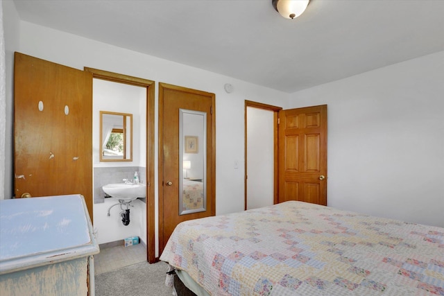 1310 N Woodruff Rd, Spokane Valley, WA 99206 - carpeted bedroom featuring connected bathroom