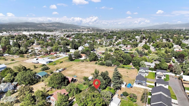 1310 N Woodruff Rd, Spokane Valley, WA 99206 - view of property location with a mountain backdrop and nearby suburban area