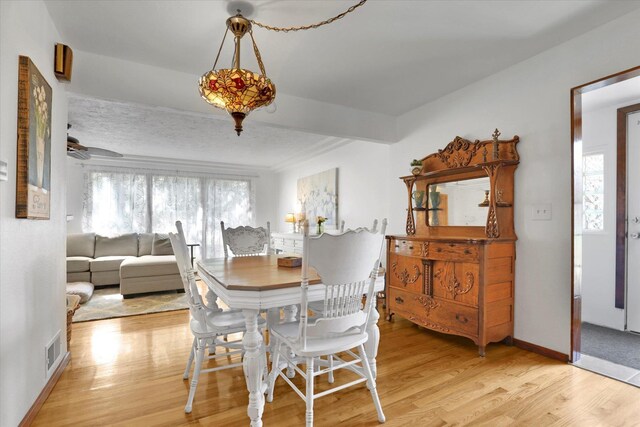 1310 N Woodruff Rd, Spokane Valley, WA 99206 - dining area with light wood-style flooring and baseboards