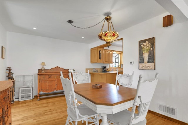 1310 N Woodruff Rd, Spokane Valley, WA 99206 - dining room featuring light wood finished floors and recessed lighting