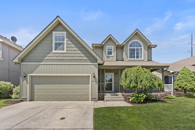 5214 S Myrtle Ln, Spokane, WA 99223 - view of front facade with concrete driveway, a front yard, a porch, and an attached garage