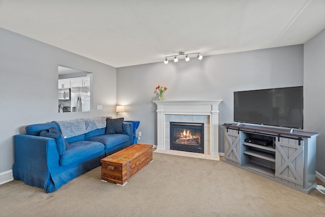 5214 S Myrtle Ln, Spokane, WA 99223 - carpeted living room with a tile fireplace and baseboards