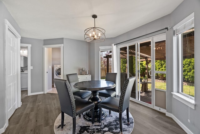 5214 S Myrtle Ln, Spokane, WA 99223 - dining space with dark wood-style flooring, plenty of natural light, a chandelier, and washer / clothes dryer