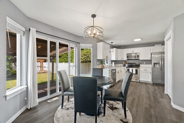 5214 S Myrtle Ln, Spokane, WA 99223 - dining room with a chandelier and dark wood finished floors