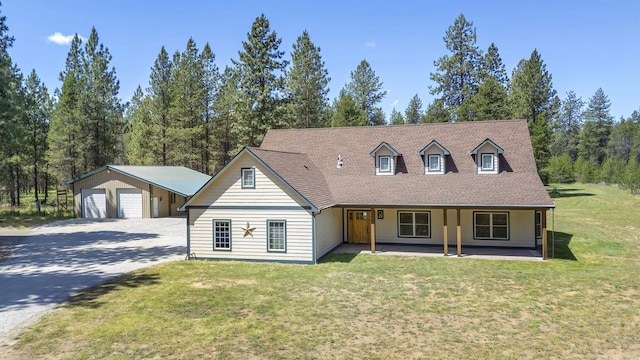 38415 N Hatch Rd, Deer Park, WA 99006 - view of front of home with a garage, a front lawn, an outdoor structure, driveway, and a shingled roof