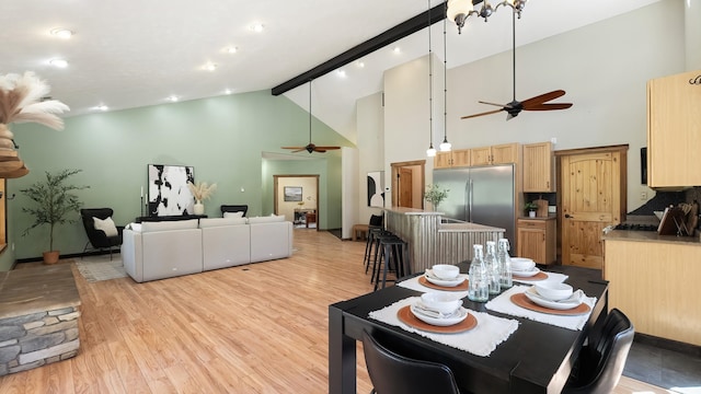 38415 N Hatch Rd, Deer Park, WA 99006 - dining space featuring a ceiling fan, light wood-style flooring, high vaulted ceiling, and beam ceiling