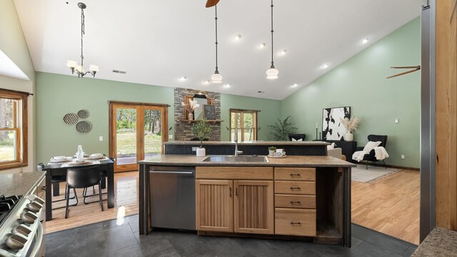 38415 N Hatch Rd, Deer Park, WA 99006 - kitchen with dishwasher, open floor plan, plenty of natural light, pendant lighting, and high vaulted ceiling