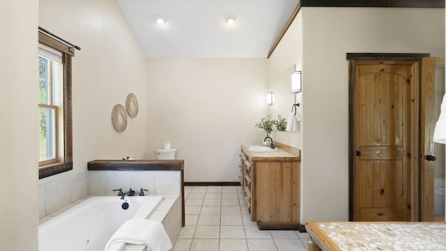 38415 N Hatch Rd, Deer Park, WA 99006 - full bathroom featuring vanity, a tub with jets, tile patterned flooring, and vaulted ceiling