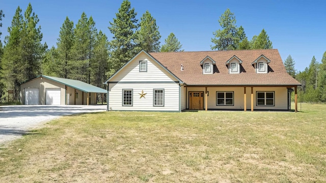 38415 N Hatch Rd, Deer Park, WA 99006 - view of front of home with a detached garage, an outdoor structure, a front lawn, and driveway