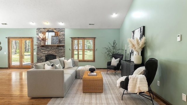 38415 N Hatch Rd, Deer Park, WA 99006 - living area with wood finished floors, lofted ceiling, and a fireplace