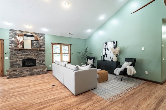 38415 N Hatch Rd, Deer Park, WA 99006 - living room with wood finished floors, a stone fireplace, and lofted ceiling