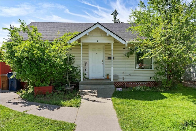 2624 E Boone Ave, Spokane, WA 99202 - view of front facade featuring a shingled roof and a front lawn
