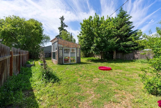 2624 E Boone Ave, Spokane, WA 99202 - fenced backyard featuring an exterior structure and an outbuilding