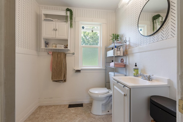 2624 E Boone Ave, Spokane, WA 99202 - bathroom with wallpapered walls and vanity
