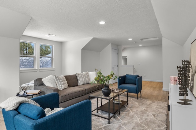 1301 S Roberts Rd, Newport, WA 99156 - living room with a textured ceiling, light wood-style flooring, and recessed lighting