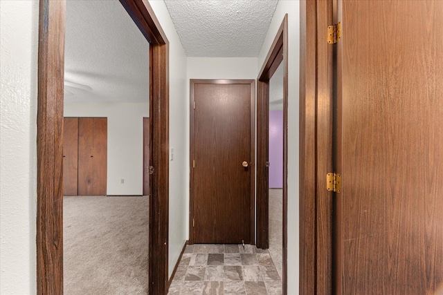 2121 E Upriver Dr Unit # 61, Spokane, WA 99207 - hallway featuring a textured ceiling