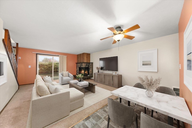 2121 E Upriver Dr Unit # 61, Spokane, WA 99207 - living room with a lit fireplace and a ceiling fan