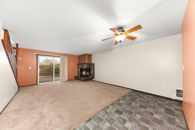 2121 E Upriver Dr Unit # 61, Spokane, WA 99207 - unfurnished living room featuring ceiling fan, a fireplace, and stairway
