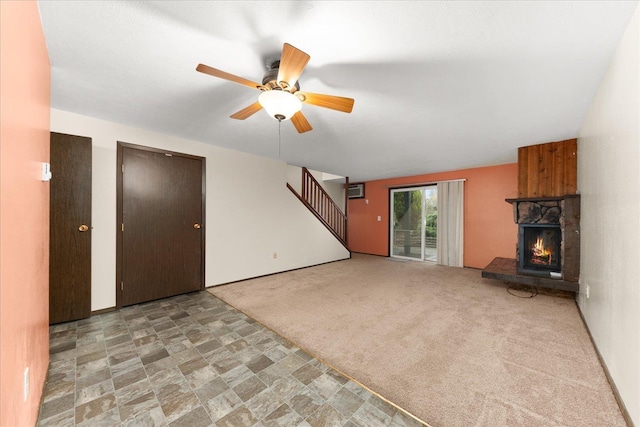 2121 E Upriver Dr Unit # 61, Spokane, WA 99207 - unfurnished living room with stairs, a fireplace, a ceiling fan, and carpet