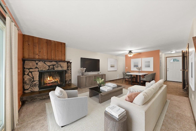 2121 E Upriver Dr Unit # 61, Spokane, WA 99207 - living room with a fireplace, a ceiling fan, and light colored carpet