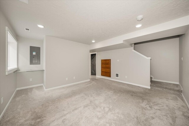 1840 N Wolfe Penn St, Liberty Lake, WA 99019 - basement featuring electric panel, carpet floors, recessed lighting, stairs, and a textured ceiling