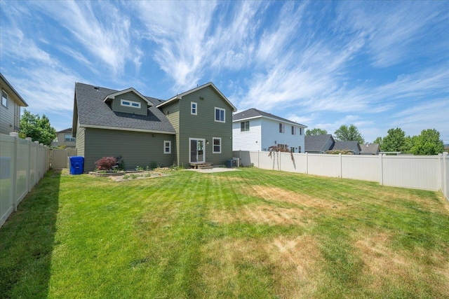 1840 N Wolfe Penn St, Liberty Lake, WA 99019 - back of house featuring a fenced backyard and a shingled roof