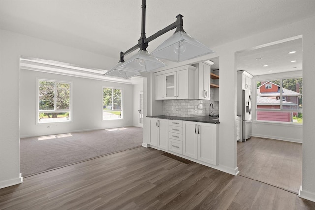 215 E 18th Ave, Spokane, WA 99203 - kitchen with open floor plan, dark countertops, white cabinetry, dark wood-style flooring, and recessed lighting