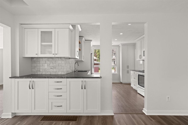 215 E 18th Ave, Spokane, WA 99203 - kitchen featuring stove, white cabinetry, open shelves, dark countertops, and dark wood-type flooring