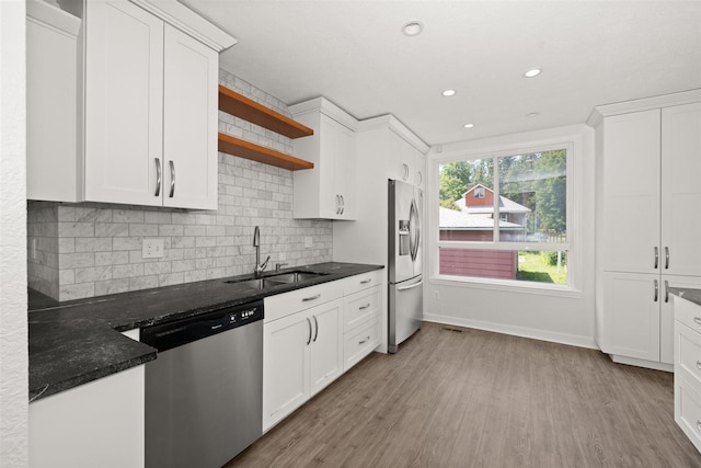 215 E 18th Ave, Spokane, WA 99203 - kitchen featuring appliances with stainless steel finishes, light wood-type flooring, white cabinetry, open shelves, and backsplash