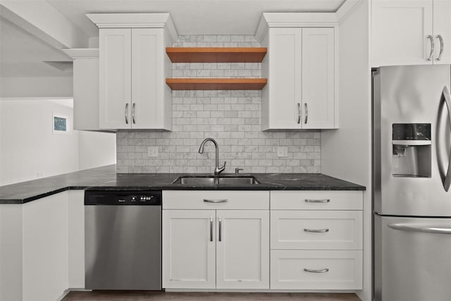 215 E 18th Ave, Spokane, WA 99203 - kitchen with appliances with stainless steel finishes, open shelves, white cabinets, and decorative backsplash