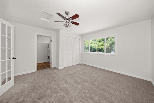 215 E 18th Ave, Spokane, WA 99203 - unfurnished bedroom with estacked washer and dryer, carpet, a closet, and ceiling fan
