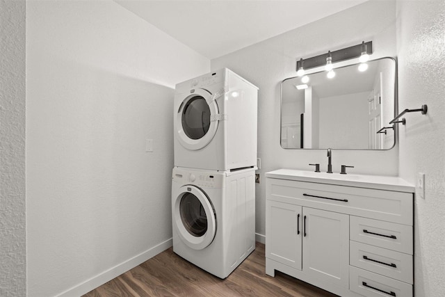 215 E 18th Ave, Spokane, WA 99203 - washroom with stacked washer / dryer and dark wood finished floors