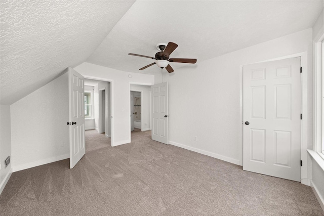215 E 18th Ave, Spokane, WA 99203 - additional living space featuring carpet, a textured ceiling, ceiling fan, and vaulted ceiling