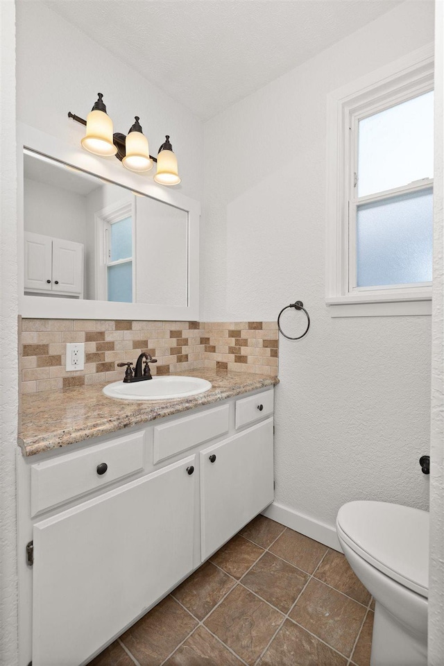 215 E 18th Ave, Spokane, WA 99203 - half bath with backsplash, vanity, and tile patterned floors