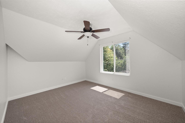 215 E 18th Ave, Spokane, WA 99203 - additional living space featuring vaulted ceiling, carpet, a ceiling fan, and a textured ceiling