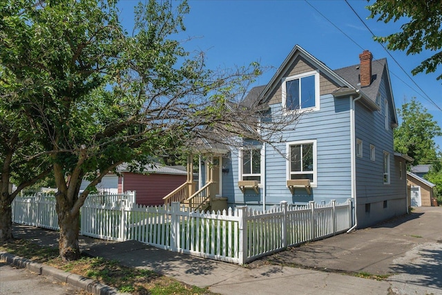 215 E 18th Ave, Spokane, WA 99203 - view of front of property featuring a chimney and a fenced front yard
