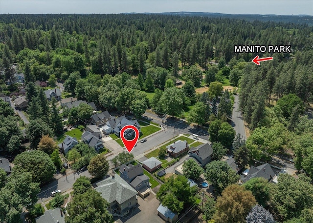 215 E 18th Ave, Spokane, WA 99203 - aerial overview of property's location featuring a forest and nearby suburban area