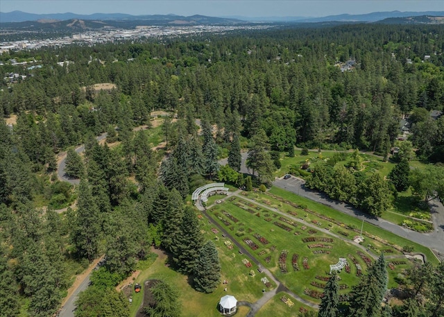 215 E 18th Ave, Spokane, WA 99203 - aerial view of property and surrounding area with a heavily wooded area and a mountainous background