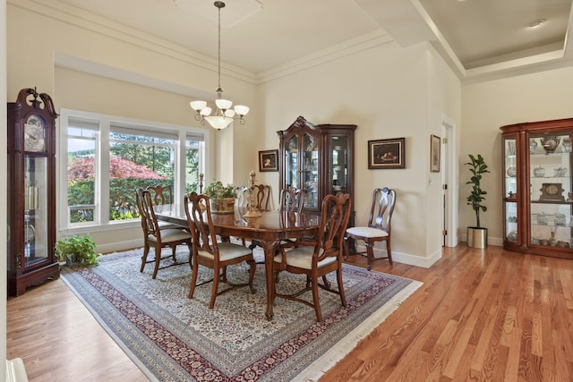 6815 S Palouse Hwy, Spokane, WA 99223 - dining space featuring a chandelier, light wood-type flooring, and crown molding